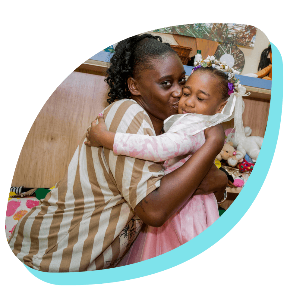 mother embracing daughter in petal frame