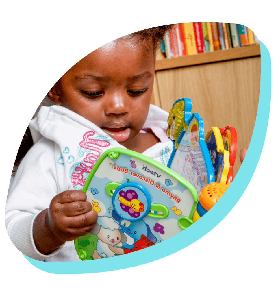 young child reading a book petal frame