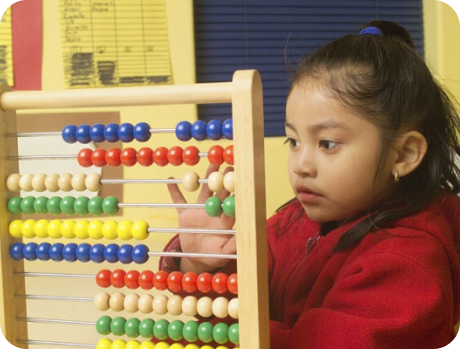 Child learning numbers in a classroom